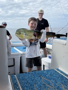 Child Holding Fish Boat