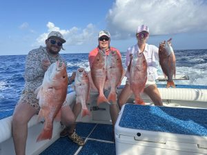People Holding Fish Boat